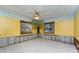 Bedroom with painted tree mural and ceiling fan; currently under renovation at 341 Severin Se Rd, Port Charlotte, FL 33952