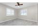 Simple bedroom with two windows and ceiling fan at 341 Severin Se Rd, Port Charlotte, FL 33952