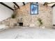 Living room with stone fireplace and exposed wooden beams at 341 Severin Se Rd, Port Charlotte, FL 33952