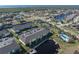 Aerial view of canal-front building with parking and pool at 4000 Bal Harbor Blvd # 126, Punta Gorda, FL 33950