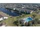 Aerial view showcasing condo building, pool, and canal views at 4000 Bal Harbor Blvd # 126, Punta Gorda, FL 33950