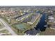 Aerial view of condo building and tennis court at 4000 Bal Harbor Blvd # 126, Punta Gorda, FL 33950
