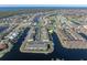 Aerial view of waterfront community with tennis court and pool at 4000 Bal Harbor Blvd # 126, Punta Gorda, FL 33950