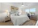 Main bedroom with king-size bed and access to a balcony at 4000 Bal Harbor Blvd # 126, Punta Gorda, FL 33950