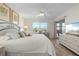 Spacious bedroom with a king-size bed and balcony access at 4000 Bal Harbor Blvd # 126, Punta Gorda, FL 33950