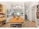 Bright dining area with a wooden table, and open to kitchen at 4000 Bal Harbor Blvd # 126, Punta Gorda, FL 33950
