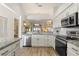 Modern kitchen with stainless steel appliances and granite counters at 4000 Bal Harbor Blvd # 126, Punta Gorda, FL 33950