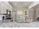 Modern kitchen with stainless steel appliances and granite counters at 4000 Bal Harbor Blvd # 126, Punta Gorda, FL 33950