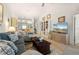 Open living room with built-in shelving and hardwood floors at 4000 Bal Harbor Blvd # 126, Punta Gorda, FL 33950