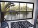 Spacious balcony with water view, black and white rug, and outdoor seating at 4048 Oakview Dr # F2-3, Punta Gorda, FL 33980
