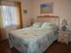 Bedroom with queen bed and ocean decor at 4048 Oakview Dr # F2-3, Punta Gorda, FL 33980