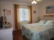 Bedroom with queen bed and ocean decor at 4048 Oakview Dr # F2-3, Punta Gorda, FL 33980