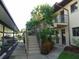 Condo building exterior showcasing stairs and landscaping at 4048 Oakview Dr # F2-3, Punta Gorda, FL 33980