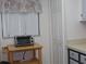 Small kitchen area with toaster oven on a cart at 4048 Oakview Dr # F2-3, Punta Gorda, FL 33980