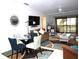 Living room featuring a sofa, dining set, and balcony access at 4048 Oakview Dr # F2-3, Punta Gorda, FL 33980