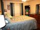 Main bedroom with a large bed, plenty of light, and teal curtains at 4048 Oakview Dr # F2-3, Punta Gorda, FL 33980