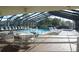 Relaxing pool area with lounge chairs and tables at 4048 Oakview Dr # F2-3, Punta Gorda, FL 33980