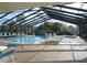Enclosed pool and spa area with ample seating at 4048 Oakview Dr # F2-3, Punta Gorda, FL 33980
