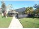 Community pool with screened enclosure and walkway at 4048 Oakview Dr # F2-3, Punta Gorda, FL 33980