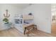 Bedroom featuring a twin-size bunk bed, light wood floors, and nautical decor at 42771 Valley Brooks St, Punta Gorda, FL 33982