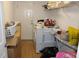 Laundry room with washer, dryer, and storage shelves at 4692 Hillman Ter, North Port, FL 34288