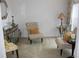 Sitting area with two plush armchairs, side tables, and decorative accents at 4692 Hillman Ter, North Port, FL 34288