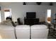 Comfy living room with a TV and access to another room at 4692 Hillman Ter, North Port, FL 34288