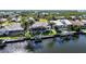 Waterfront neighborhood featuring single-Gathering homes with docks, boat lifts, and lush tropical landscaping at 5541 Almar Dr, Punta Gorda, FL 33950