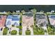 Birds-eye view of luxurious houses with backyard pools, boat docks and manicured lawns on the water at 5541 Almar Dr, Punta Gorda, FL 33950