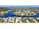 Stunning aerial view of waterfront homes on canals, showcasing Florida living and beautiful landscaping at 5541 Almar Dr, Punta Gorda, FL 33950