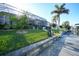 Landscaped backyard with lush greenery and canal views at 5541 Almar Dr, Punta Gorda, FL 33950