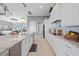 Modern kitchen boasts white cabinets, granite countertops, and stainless steel appliances at 5541 Almar Dr, Punta Gorda, FL 33950