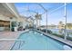 Inviting screened pool with a beautiful view of the canal at 5541 Almar Dr, Punta Gorda, FL 33950