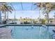 Relaxing screened pool area with floating orbs and canal views at 5541 Almar Dr, Punta Gorda, FL 33950