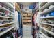 Large walk-in closet with ample shelving and drawers for storage at 5541 Almar Dr, Punta Gorda, FL 33950