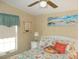 Bedroom with coastal decor, queen-size bed, and window at 6546 Greenview Ct, North Port, FL 34287