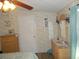 Bedroom with vanity, large window, and ceiling fan at 6546 Greenview Ct, North Port, FL 34287