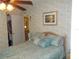 Bedroom with a queen-size bed and ceiling fan at 6546 Greenview Ct, North Port, FL 34287