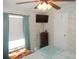 Bedroom with a dresser, ceiling fan, and window at 6546 Greenview Ct, North Port, FL 34287