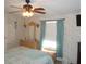 Bedroom featuring a dresser, large mirror and window at 6546 Greenview Ct, North Port, FL 34287