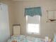 Bedroom with window, chair and coastal decor at 6546 Greenview Ct, North Port, FL 34287