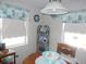 Bright dining area with table, chairs, and decorative shelf at 6546 Greenview Ct, North Port, FL 34287