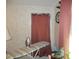 Small laundry area with ironing board and window at 6546 Greenview Ct, North Port, FL 34287
