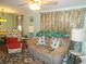 Living room with couch, recliner, and patterned rug at 6546 Greenview Ct, North Port, FL 34287
