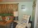 Living room with couch, armchair, and end table at 6546 Greenview Ct, North Port, FL 34287