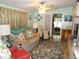 Living room with couch, loveseat, and patterned rug at 6546 Greenview Ct, North Port, FL 34287