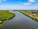 Aerial view of waterfront homes and natural landscape at 8265 Dafoe St, Port Charlotte, FL 33981