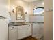 Elegant bathroom with granite countertop and walk-in shower at 8265 Dafoe St, Port Charlotte, FL 33981