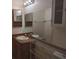 Functional bathroom showcasing double sinks, large mirrors and storage shelves at 11332 8Th Ave, Punta Gorda, FL 33955