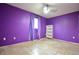 Purple bedroom with tile floors, a ceiling fan, a window and closet at 11332 8Th Ave, Punta Gorda, FL 33955